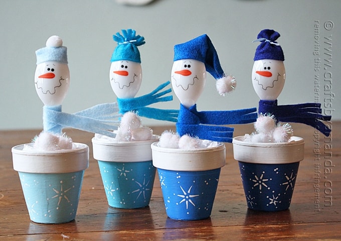 snowmen made with plastic spoons