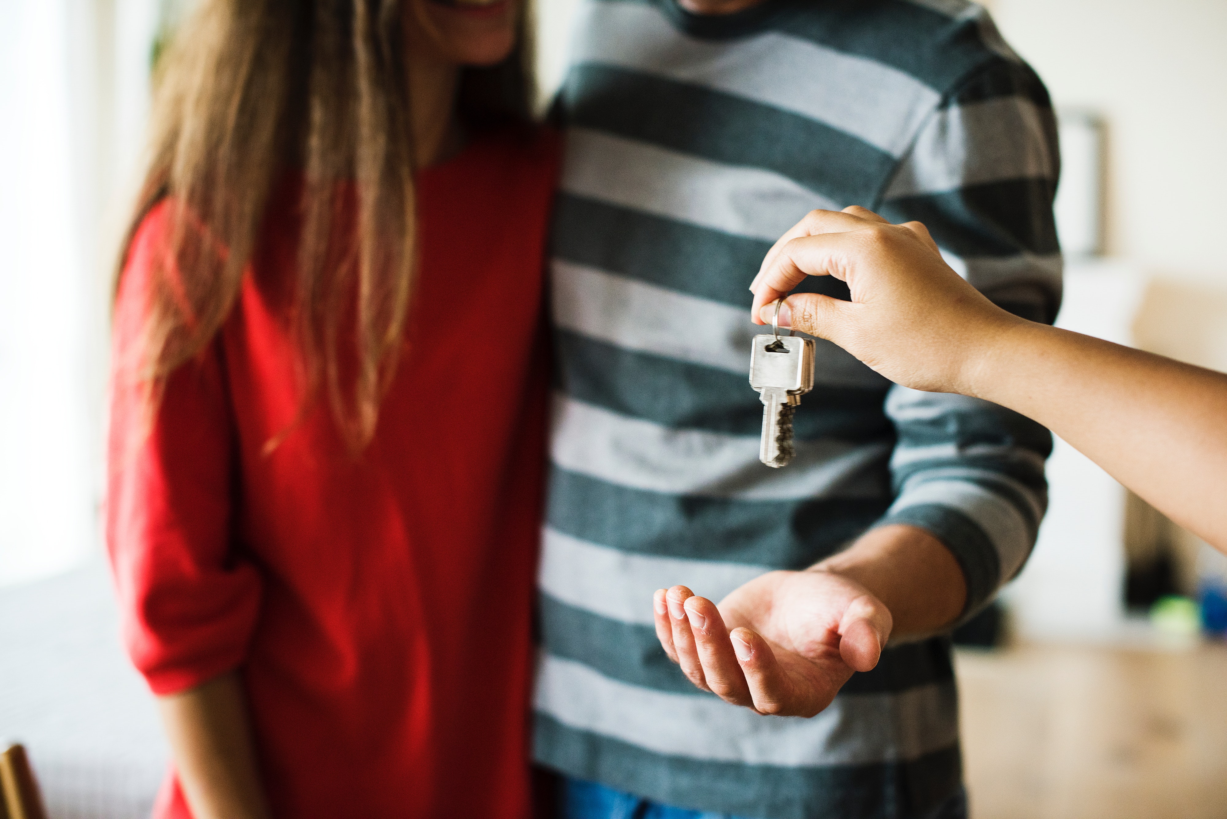 couple being handed house keys