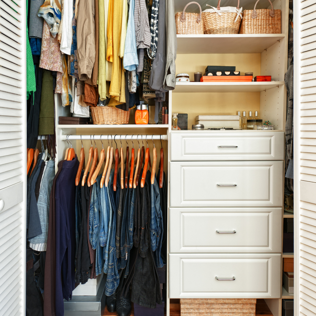 neat closet with shelves and clothes