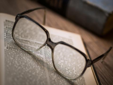 Image of eye glasses on a book