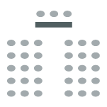 a table with seating facing rows of seating. 